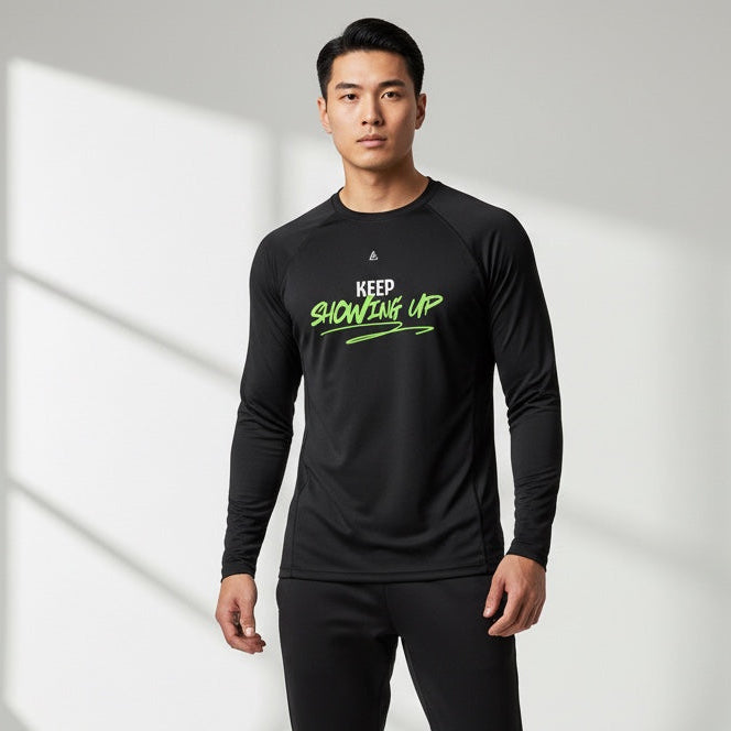 Man wearing a black athletic outfit with green text on a white background