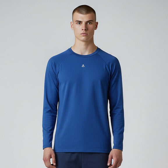 Man wearing a blue long-sleeve shirt and navy shorts on a white background